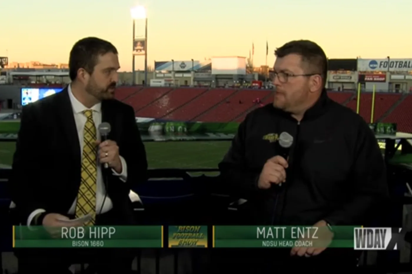 Rob Hipp interviewing a football coach